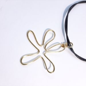 Flower gold pendant with leather cord